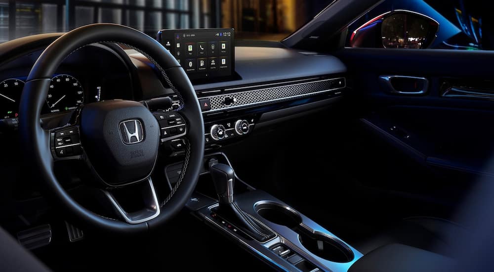 Wheel and dashboard in the interior of a 2026 Honda Civic.