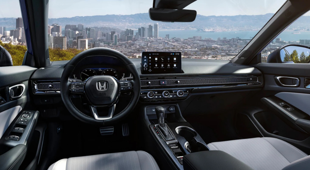 Interior of 2026 Honda Civic showing digital gauge cluster and infotainment system.