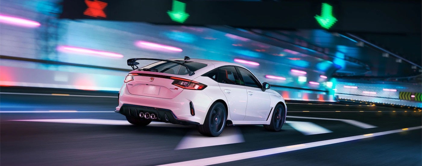 A white 2025 Honda Civic Type R from the rear at an angle after visiting Honda dealers.