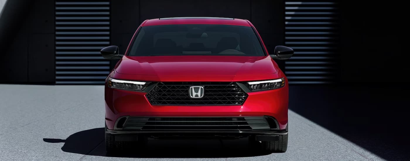 A red 2026 Honda Accord parked in a driveway
