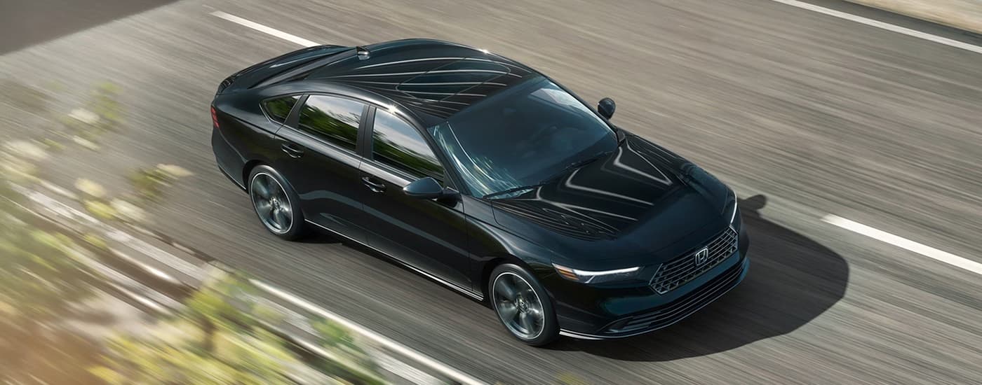 Black 2026 Honda Accord driving on a highway