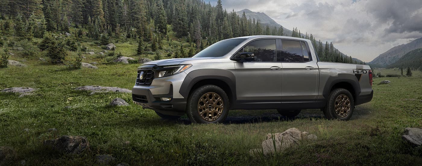 A silver 2025 Honda Ridgeline from the side after leaving a Honda dealer in Birmingham.